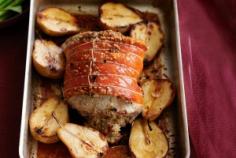 Roast pork with macadamia and sage stuffing with roasted pears