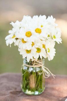Daisies in a mason jar - wedding reception table centrepiece