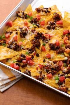 Grilled nachos - just layer taco flavors in a foil pan, cover and dig into the melty goodness in minutes!