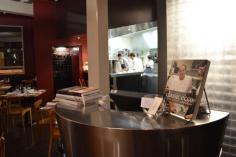 Miss Foodie - Ecco Bistro A venue’s use of lighting is one of the most crucial elements to the space and Ecco evidently understand that. I love their eclipse-style wall lights around the edge of the room, which glow peacefully against the warm red walls. This coupled with the radiance of dispersed light reflecting off the exposed white beams and ceiling rafters makes Ecco’s interior difficult to fault.