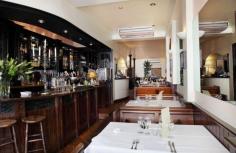 A Cena in Twickenham, London. Beautiful Italian food and a sexy interior that's all about dark panelling, white tablecloths and low lighting.