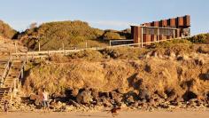 
                    
                        Viewed from the water, the rusted facade of this coffee kiosk blends in seamlessly with Australia's craggy coastline.
                    
                