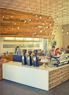 
                    
                        The bar and shelves of this local coffee shop feature salvaged douglas fir. The counter is capped in Caesarstone.  Photo by: Ted Holladay
                    
                