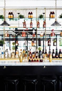 
                    
                        Mirrored bar back with vintage pendants
                    
                