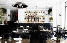 
                    
                        Black painted bar with vintage fixtures
                    
                