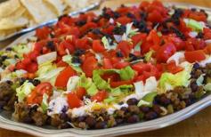 
                    
                        Layered Taco Pie Recipe. Let the kiddos help you make this dinner by adding the layers. #recipe #dinner  skiptomylou.org
                    
                