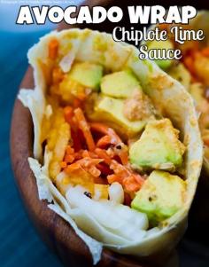 AVOCADO WRAP Florida Avocado Summer Wrap vegan, makes 2 wraps  2 extra large wraps 1/2 Florida Avocado, peeled and sliced into thick strips 1 medium yellow tomato, sliced thick (red works too) 1 small sweet onion, sliced 4 T lime juice (or lemon) 1 T apple cider vinegar (or more lime juice) 2 t  maple syrup 6 T spicy bean or nut spread (see below) 1 cup shredded carrots fresh ground black pepper optional: pumpkin seeds