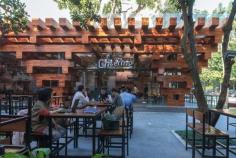 
                    
                        Stacks of timber create an open light-filled space for this restaurant
                    
                