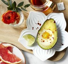 Egg-in-an-avocado. Heat oven to 375°F. Cut 1 avocado in half, remove the pit, and scoop out 2 to 3 Tbsp of flesh. Crack 1 large egg into the hole; bake egg-avocado for 15 minutes until the white is just set but the yolk is still runny. Finish with salt and pepper, a touch of chile pepper, a drizzle of olive oil, and a squeeze of lime juice. Serve with 1 cup sliced grapefruit. Makes 1 serving. Each serving: 313 cal, 21 g fat (4 g sat fat), 10 g pro, 27 g car, 5 g fiber. - Redbook.com