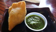 
                    
                        Samosa with mint chutney.  I love samosas.
                    
                