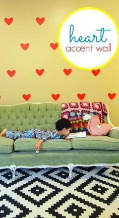 
                    
                        Stick a whole bunch of these heart DIY wall decals onto your living room wall to make a fun (and temporary) Valentine’s Day themed accent wall!
                    
                