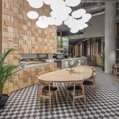 
                    
                        There’s a 1950s feel to the interior of dinette — cast your eyes upwards and observe the squadron of flying saucer-ey hand-made light fittings hovering above the central communal table. Goodness knows what’s in the top drawers, but you’ll need a long pair of legs or some step-ladders to find out...
                    
                