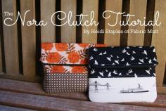
                    
                        zippered, fold-over top clutch bag
                    
                