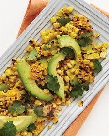 Corn, Avocado, and Cilantro Salad - Martha Stewart Living, June 2011 Yield Serves 4. 4 shucked ears of corn. 1 sliced Hass avocado. 1/4 cup fresh cilantro. 1 tablespoon fresh lime juice. 1 tablespoon extra-virgin olive oil.1/2 teaspoon coarse salt. Heat grill to medium-high. Grill corn, rotating often, until lightly charred, 15 min. cool slightly. cut kernels from cob. toss with avocado, cilantro, lime juice, olive oil & salt. roasted pork loin or grilled lean pork chops.