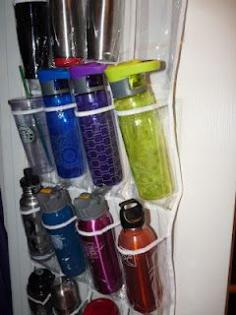 Travel #mugs and #water #bottle #storage in an over-the-door shoe organizer. What a great idea for #families! #waterbottle #home #spacesaver #family #kids #HerSolution