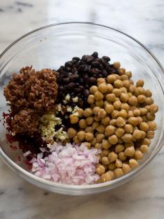 Irresistible Veggie Burgers Makes six burgers  Patties: 8 ounces beets, steamed or roasted and peeled* 1 (15 ounce) can garbanzo beans, washed and drained 1 (15 ounce) can black beans, washed and drained 1/2 cup cooked brown rice 1/4 cup rolled oat flour** 1/2 red onion, diced 2 garlic cloves, minced 1 teaspoon sumac 1 teaspoon dried thyme leaves 3/4 teaspoon ground cumin 1/4 teaspoon ground coriander Salt Pepper