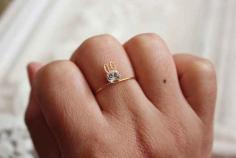 
                    
                        This petite bunny ring with a single Swarovski crystal.
                    
                