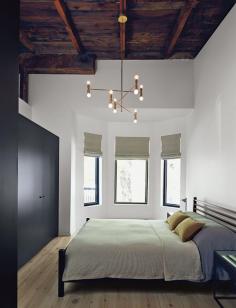 
                    
                        Montreal master bedroom with the original roof exposed
                    
                