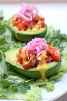 Salmon tartare stuffed avocados with mango chili sauce
