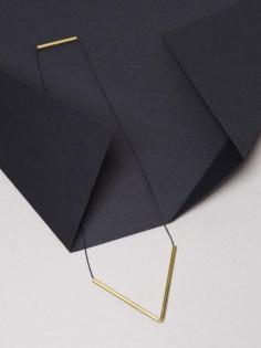 
                    
                        Brass V Necklaces by graduate architect and jewellery designer Jenna Rowe. Styling – Nat Turnbull. Photo – Elise Wilken for The Design Files.
                    
                