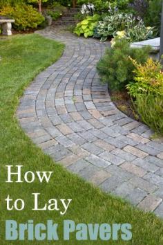 Garden Landscape with walking paver path, benches and plants Stock Photo