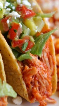 Slow Cooker Pineapple Salsa Chicken Tacos ~ Incredibly easy - You add three ingredients to the slow cooker along with the chicken... Sweet fruit preserves mixed with spicy salsa and taco seasoning creates a sweet and tender meat and when combined with all the toppings, you will have one flavor-loaded taco.