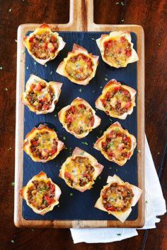 
                    
                        These fun Crunchy Taco Cups are made in a muffin tin with wonton wrappers!  Great for a taco party/bar. Everyone can add their own ingredients and toppings! Crunchy, delicious, and fun to eat!
                    
                