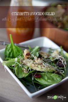 Cranberry avocado salad with sweet white balsamic vinaigrette.
