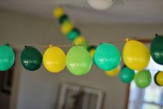 Creating a balloon garland - perfect for parties and holiday decor! See how to create this at www.thedempsterlogbook.com
