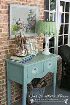 
                    
                        Thrift store needlework art become a showpiece on the screened porch with a new finish to the frame.
                    
                