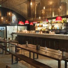 
                    
                        Any place that uses lampshades made to look like Fez hats isn’t taking itself too seriously, and a sense of humour goes a long way towards creating a convivial atmosphere. Reclaimed railway sleepers are now serving as communal tables in a large central dining area looking onto an open kitchen...
                    
                