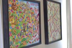 Great idea Game Board Storage Art.  Awesome idea for game room, play room or kid's room.  Hang board games in a frame with no glass on the wall.  Attach a baggie on the back to hold pieces.  Also a suggestion to screw eyelets in corners of board and hang with ribbon.