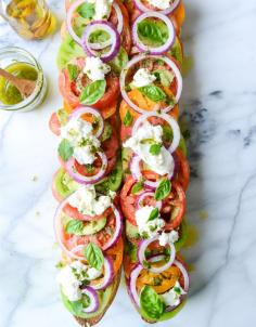 
                    
                        heirloom tomato, avocado and burrata grilled garlic toast
                    
                
