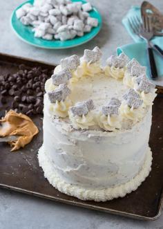 
                    
                        Puppy Chow Cake - chocolate and peanut butter cake loaded with puppy chow in between each layer!
                    
                