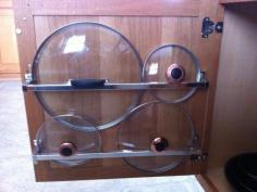 Kitchen idea- mount towel racks to back of cabinet door to hold lids.