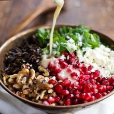 Pomegranate, Kale, and Wild Rice Salad with Walnuts and Feta Recipe Salads with pomegranate seeds, kale, wild rice, toasted walnuts, feta cheese, minced onion, olive oil, water, honey, apple cider vinegar, salt, lemon juice