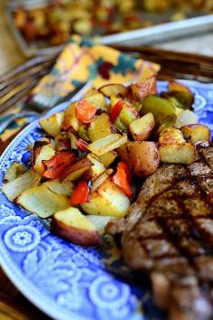 "BREAKFAST POTATOES"  5 Pounds Red Potatoes, Cut Into Chunks 4 cloves Garlic, Minced 1 whole Onion,  Roughly Chopped 4Green +redPeppers, Roughly Chopped 1/4 cup Olive Oil 1/2 stick Butter, Melted 1 teaspoon Seasoned Salt 1/2 teaspoon Cayenne Pepper Salt And Pepper Preheat  to 425 F. In a large bowl, toss everything together. Pour potatoes onto two rimmed baking sheets. Bake 20-25 min, shaking the pan twice. Raise the heat to 500 degrees and bake until crisp and brown, 15-20 min, tossing 2x