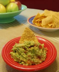 Ole! Gregarious Party Guacamole :: This recipe is a delicious mingling of fresh pico de gallo, avocados, and lime. I recommend that you don't skip the cilantro. You'll want to triple or quadruple the recipe if you're feeding a crowd... #party #appetizer #dip