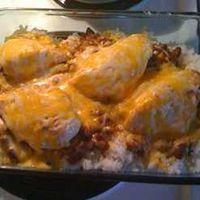 Dinner For Two: Chili Chicken And Rice ----- Tender chicken breasts on top of hearty chili and rice make for a delicious inexpensive meal for two.  Choose mild or hot chili to suit your taste.  Prep Time:10 Minutes - Cook Time: 30 Minutes - Ready In: 40 Minutes.