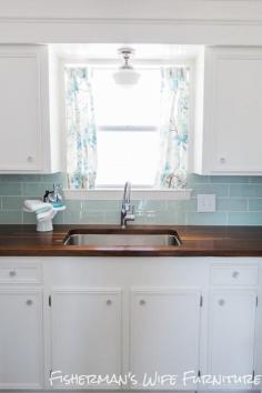 dark butcher block + glass tile backsplash.  Fisherman's Wife Furniture: DIY Kitchen Reveal Update..LIKE the butcher block countertop!