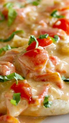 Chicken with Tomato Parmesan Sauce ~ Pan seared chicken breasts are topped with a creamy tomato parmesan sauce that is made in the same pan for an easy weeknight dinner.