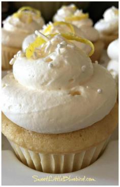 LEMON CUPCAKES with LEMON CURD FILLING and LEMONY WHIPPED CREAM FROSTING - A lemon lovers dream. | SweetLittleBluebird.com