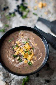 Spicy black bean soup with sour cream and crushed nachos on top. Swap the sour cream for greek yogurt to make it even healthier. Recipe below photo. egle ma https://www.flickr.com/photos/egle_aleks/6750313289/in/photostream/ #blackbeansoup #blackbeans #spicysoup #hispanicfood