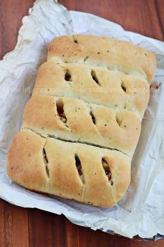 Light and flavorful olive oil rolls filled with tomatoes, olives, onion and feta cheese for a great weeknight dinner accompanied with a light salad