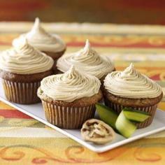 Zucchini Cupcakes w/ caramel icing 3 eggs 1-1/3 cups sugar 1/2 cup canola oil 1/2 cup orange juice 1 teaspoon almond extract 2-1/2 cups all-purpose flour 2 teaspoons ground cinnamon 2 teaspoons baking powder 1 teaspoon baking soda 1 teaspoon salt 1/2 teaspoon ground cloves 1-1/2 cups shredded zucchini CARAMEL FROSTING: 1 cup packed brown sugar 1/2 cup butter, cubed 1/4 cup 2% milk 1 teaspoon vanilla extract 1-1/2 to 2 cups confectioners' sugar