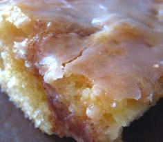 HONEY BUN COFFEE CAKE •1 box yellow cake mix •8 ounce tub sour cream •4 eggs •3/4 c. vegetable oil •1 c brown sugar •1 Tbsp ground cinnamon •2 c. powdered sugar •4 Tbsp. milk •1 Tbsp. vanilla