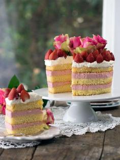Strawberry Cheesecake Sponge Cake. Layers of fresh strawberry cheesecake between light as air sponge. Topped with cream & strawberries