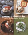 Amuse-bouche (pronounced ah-myuz boosh) are today what hors d'oeuvres were to America in the 1950s: a relatively unknown feature of French culinary tradition that, once introduced, immediately became standard fare. Chefs at many fine restaurants offer guests an amuse-bouche, a bite-sized treat that excites the tongue and delights the eye, before the meal is served. Nobody does it better than the celebrated executive chef/partner of Chicago's Tru, Rick Tramonto. Amuse-bouche are a fa-vorite of diners at Tru, many of whom come expressly to enjoy the "grand amuse"-an assortment of four different taste sensations. Amuse-Bouche offers an array of recipes, from elegant and sophisticated to casual and surprising-but always exquisite-that will inspire home cooks to share these culinary jewels with their guests. From Black Mission Figs with Mascarpone Foam and Prosciutto di Parma to Curried Three-Bean Salad, from Soft Polenta with Forest Mushrooms to Blue Cheese Foam with Port Wine Reduction, Tramonto's creations will embolden the novice and the experienced cook alike to experiment with unfamiliar ingredients and techniques. Organized by type of amuse and season of the year, the book also includes a directory of sources for specialty products. With more than a hundred recipes and with fifty-two full-page color photographs by James Beard Award-winning photographer Tim Turner, Amuse-Bouche enchants the eyes as much as an amuse pleases the palate.