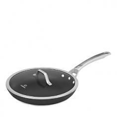 Fry Pans & Skillets - These 8 inch and 10 inch nonstick omelette pans feature durable "Sear" nonstick surface perfect for preparing eggs and omelettes, searing steaks, chicken breasts or seafood. With ultra-smooth surface, these nonstick skillets let you cook with little to no oil or butter for healthier entrees. The nonstick surface is so durable, you can cook with your favorite metal spatulas, spoons and whisks and easily flip sausages, hamburgers and heavier foods without scratching the surface. The convenience of two Calphalon fry pans in one set, 10 inch and 12 inch, feature wide, flat bottoms and an easy-release nonstick surface perfect for preparing grilled cheese sandwiches, hamburgers, potatoes or pork cutlets. The 12 inch fry pan includes tempered glass lid. Brushed stainless steel handles are riveted for durability and stay cool to the touch. Oven safe to 500 F. Lid with the 12 inch pan is oven safe to 400 F. Made in the USA. Dishwasher safe. Founded in 1963, Calphalon is a leading American manufacturer of professional quality cookware. Calphalon originated by supplying cookware to restaurants and commercial kitchens. Today, Calphalon offers a full range of cookware, bakeware and kitchen accessories to fit the culinary needs and styles of the home cook and professional chef. Product Features Calphalon hard anodized aluminum cookware conducts heat evenly to cook flawless eggs and omelettes, sear steaks or seafood "Sear" nonstick surface provides easy release for effortless cleanup Nonstick surface is durable to safely use metal, spatulas, spoons and whisks Brushed stainless steel loop handles stay cool to the touch Handles are riveted for durability 12 inch fry pan includes tempered glass lid PFOA-free interior Established in 1963, Calphalon is the culinary authority in kitchenware, dedicated to enhancing the home chef's experience during planning, prep work, cooking, baking and serving - Specifications Model: 1948259 Materials: hard anodized aluminum, nonstick interior, tempered glass lid (12" omelette pan) Lifetime manufacturer warranty Made in the USA 10" omelette pan 10 1/2" Dia. (18"L w/handles) x 3 1/2" H Base: 6" Dia. Weight: 2 lbs, 8 oz. 12" omelette pan with lid 12 1/2" Dia. (22 1/2"L w/handle) x 4"H (w/lid) Base: 7 1/2" Dia. Weight: 3 lbs, 8 oz. Care and Use Dishwasher safe Suitable for gas, electric, ceramic and halogen cooktops Pan is oven safe to 500 F Lid is oven safe to 400 F