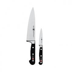 Chef's Knives - A union of classic design and modern manufacturing technology, German-made TWIN Pro "S" cutlery features high-carbon no-stain steel blades, ice-hardened for superior strength and sharpness. Elegantly curved ergonomic handles are triple-riveted for durability and permanently embedded with the Zwilling JA Henckels logo. This 8" chef's knife and 4" pairing knife with hand-honed blades chop, slice, peel and core with quick efficiency. Since 1731, the famous TWIN logo has represented superior quality for professional chefs and serious cooks worldwide. Product Features One-piece precision forging ensures higher blade stability and lasting sharpness Friodur ice-hardened knife blade offers greater resistance to corrosion and pitting Hand-honed, high-carbon stainless-steel knife blade protects against rust and stains Laser-controlled knife edges stay sharp longer with a more consistent blade angle Triple-riveted Novodur synthetic handle is unbreakable and perfectly b - Specifications Model: 35645-000 Material: ice-hardened high carbon stainless-steel blade; Novodur synthetic handle Chef's Knife Size: 8"L blade (13"L w/handle) x 1 3/4"W blade Weight: 8.5 oz. Paring Knife Size: 4"L blade (8"L w/handle) x 3/4"W blade Weight: 2 oz. Care Instructions Zwilling JA Henckels knives are dishwasher-safe but hand washing is recommended. In the dishwasher, your Zwilling JA Henckels knife may bang against other cutlery or pots and pans and knick the blade. Wipe the knife clean with a wet cloth and dishwashing detergent. Dry immediately. Dry from the back of the knife toward the blade tip. No metal is completely stain-free. To prevent slight tarnishing, be sure to remove acidic foods (lemon, mustard, ketchup, etc.) from the blade after use. If blade should show some signs of staining, clean with a non-abrasive metal polish. To prevent irreparable blade damage, it is best to store your knife in a knife block or